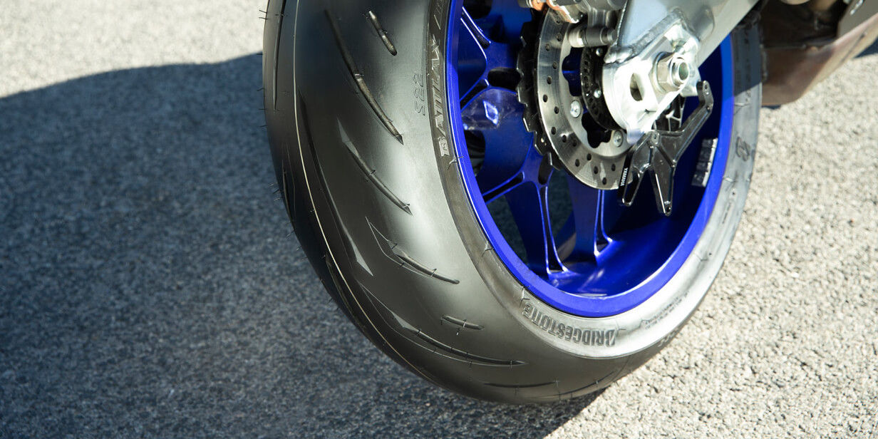 A close up of the rear Bridgestone Battlax tyre on a sporty motorcycle.
