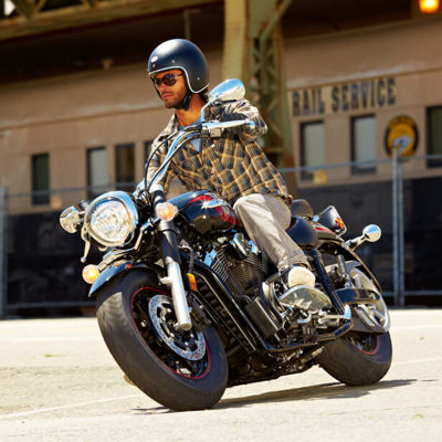 A man enjoying his ride with his classic motorbike on Bridgestone Exedra Max tyres.