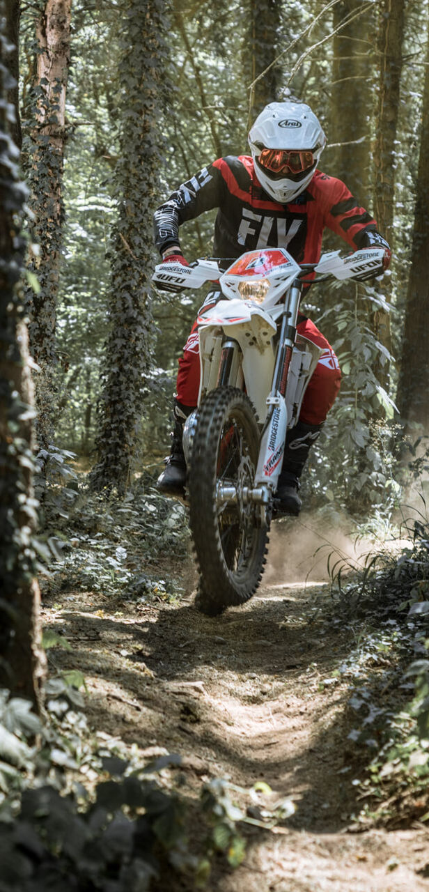 This image show a motorcycle off road with Battlecross E50 Bridgestone tyres.