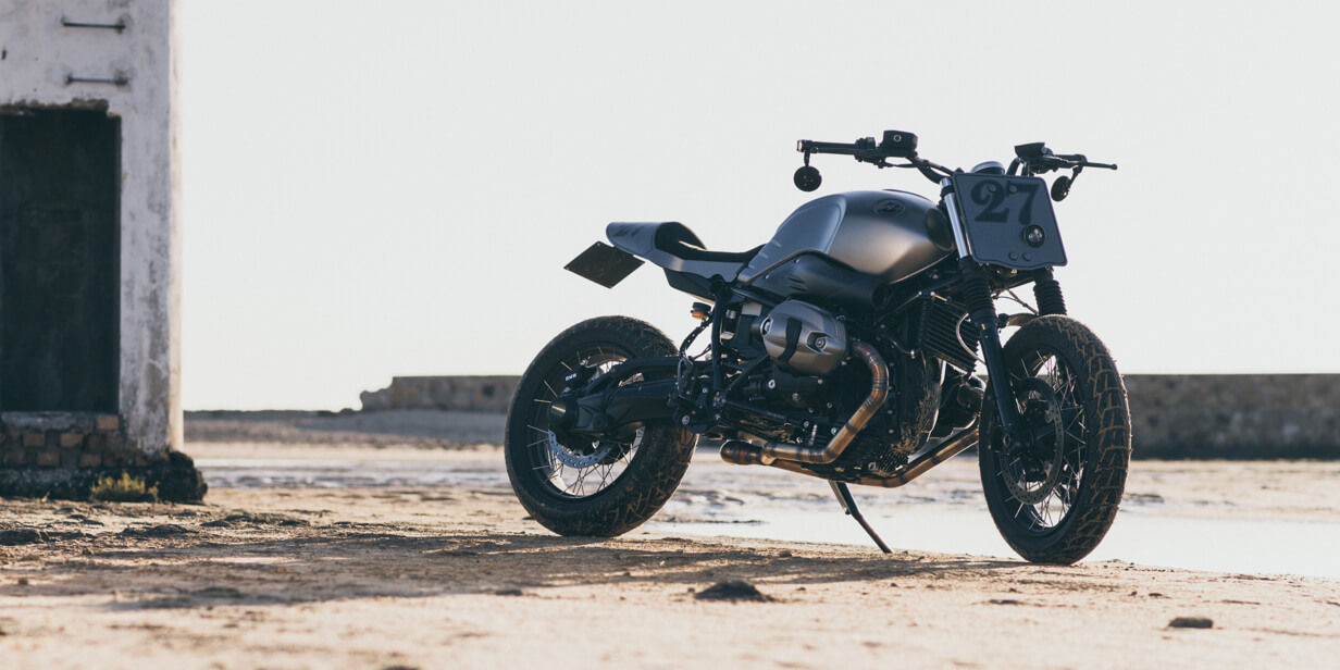 This image shows a motorcycle with Battlax Adventurecross Scrambler AX41S Bridgestone tyres.