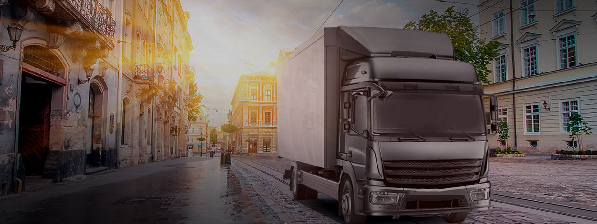 Esta imagen es un camión que utiliza neumáticos Bridgestone de camión ligero y mediano para entregar mercancías en medio de una ciudad.