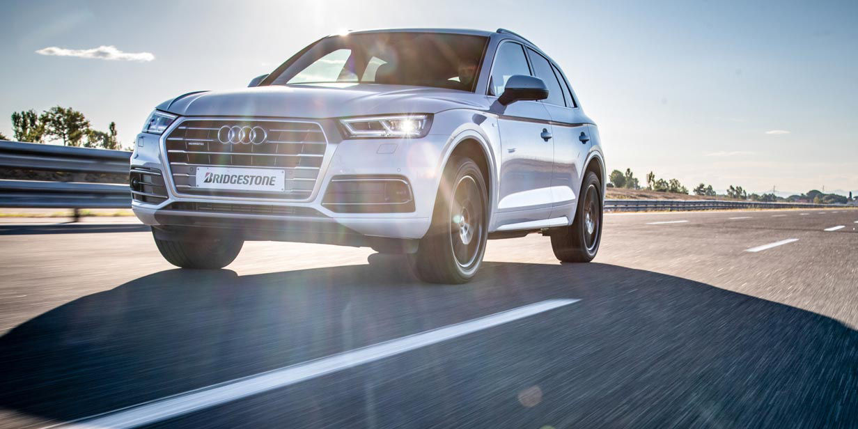 This image shows an Audi Q5 SUV maintaining stability in a straight line because of Bridgestone Potenza Sport tyres. 