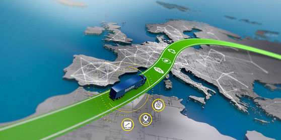 Cette image vous montre une flotte équipées des pneus Bandag circulant sur une autoroute avec un beau paysage en arrière-plan.