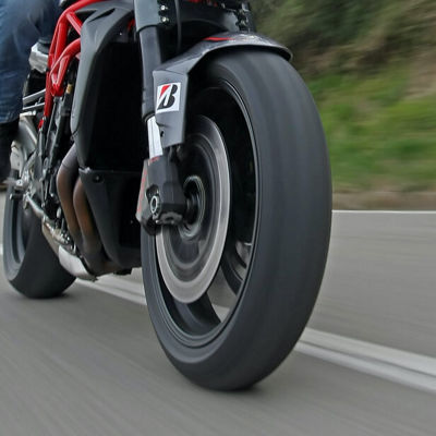 This image shows the Bridgestone Battlax tyres in action during a smooth motorcycle drive.