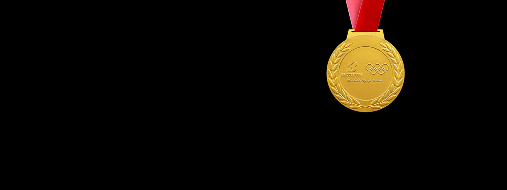 Logo Bridgestone e anelli olimpici su una medaglia d'oro su sfondo nero.