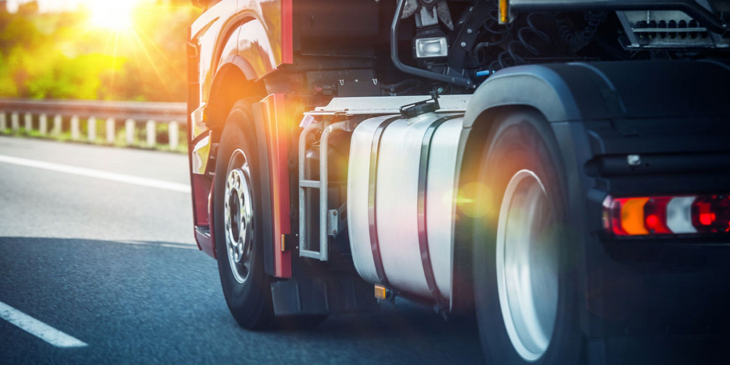 Close-up of a truck driving on a highway