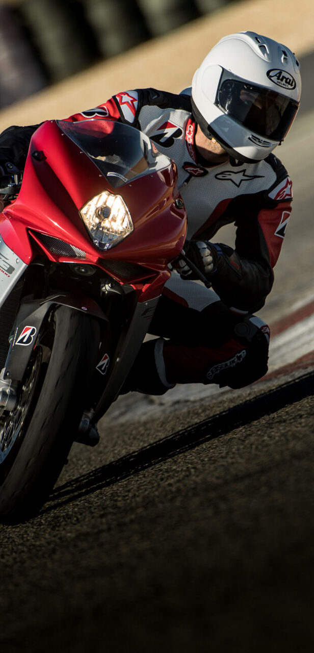 A picture taken in full race action showing a motorcycle in a corner with Bridgestone tyres.