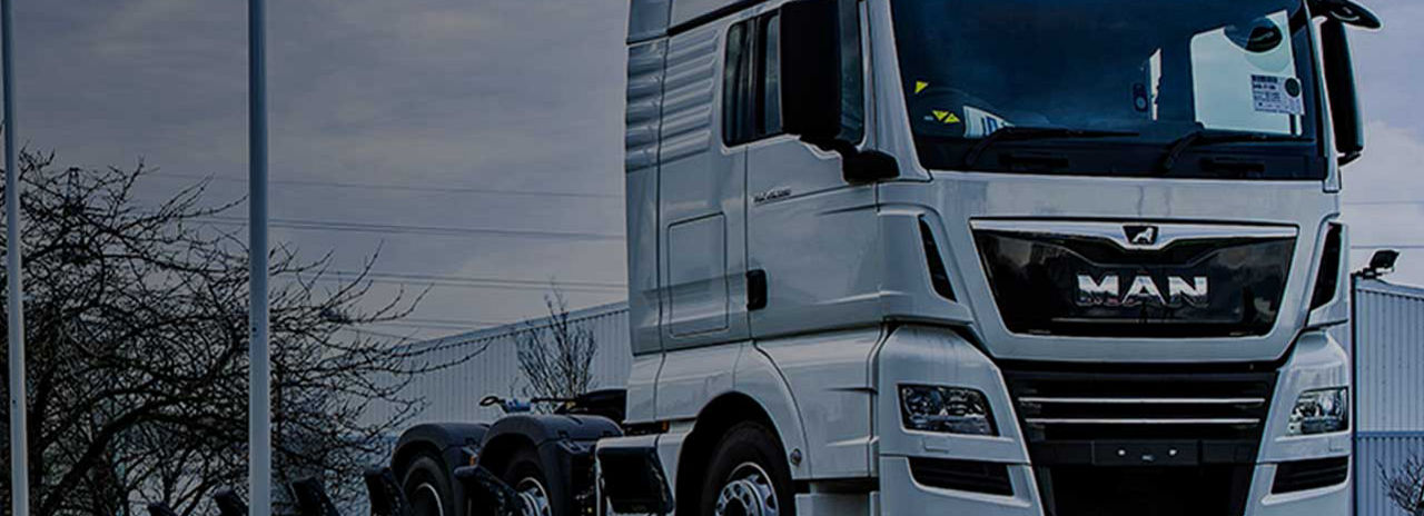 This image shows a MAN truck with Bridgestone tyres leaving a MAN facility. 