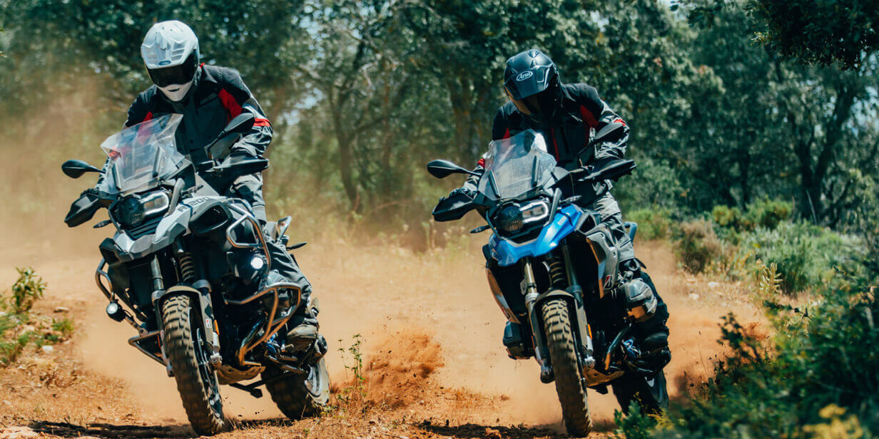 Two adventurous motorcyclists having fun off road thanks to their Bridgestone Battlax Adventurecross tyres.