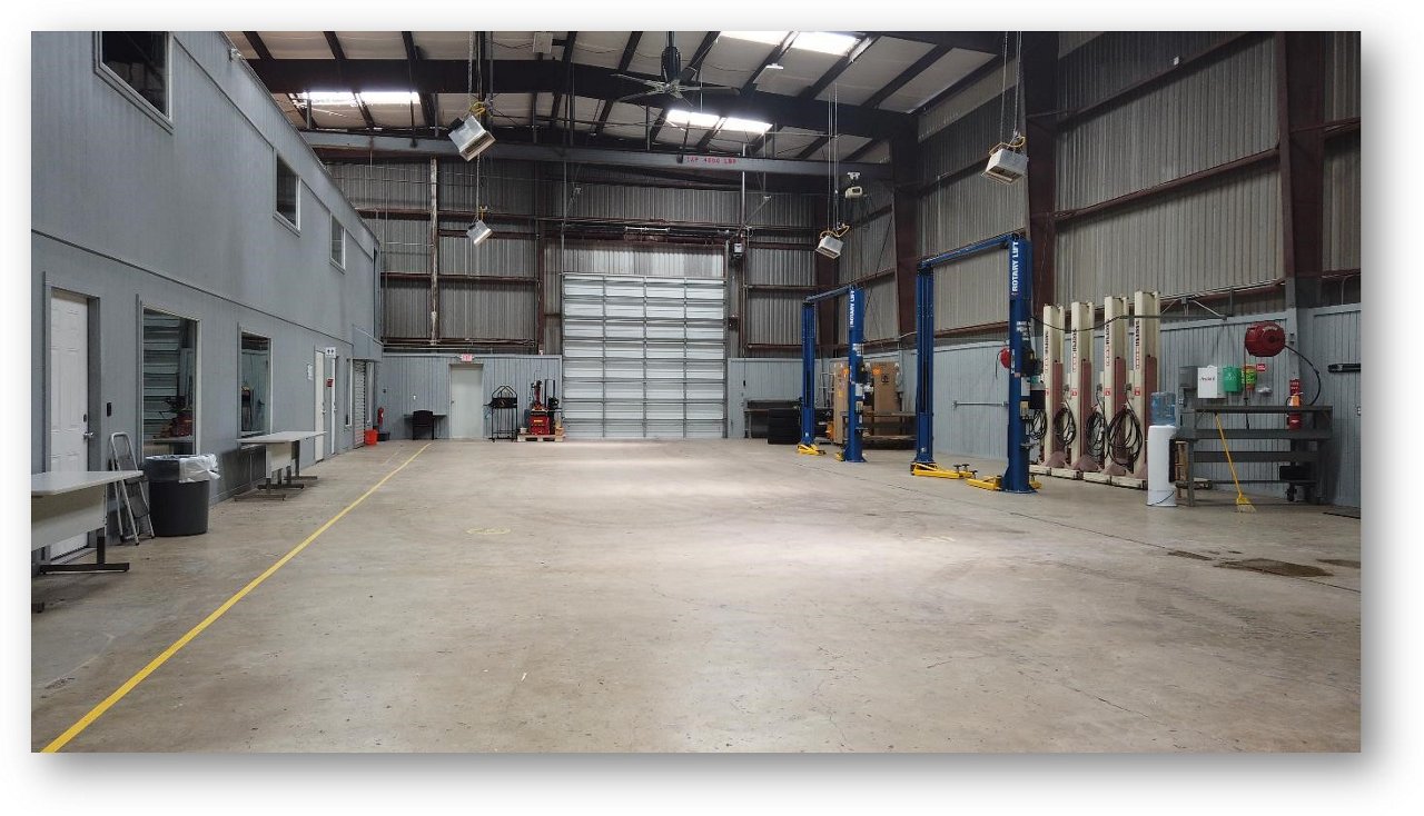 Interior of Building G at Uvalde Proving Grounds where skilled technicians service vehicles.