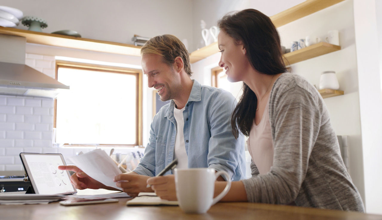 Happy, couple and tablet with documents for online payment, financial savings and banking website. Smile, woman and man with digital for paperwork of mortgage information on loan application at house; Shutterstock ID 2502383069; purchase_order: sito; job: ; client: ; other: 