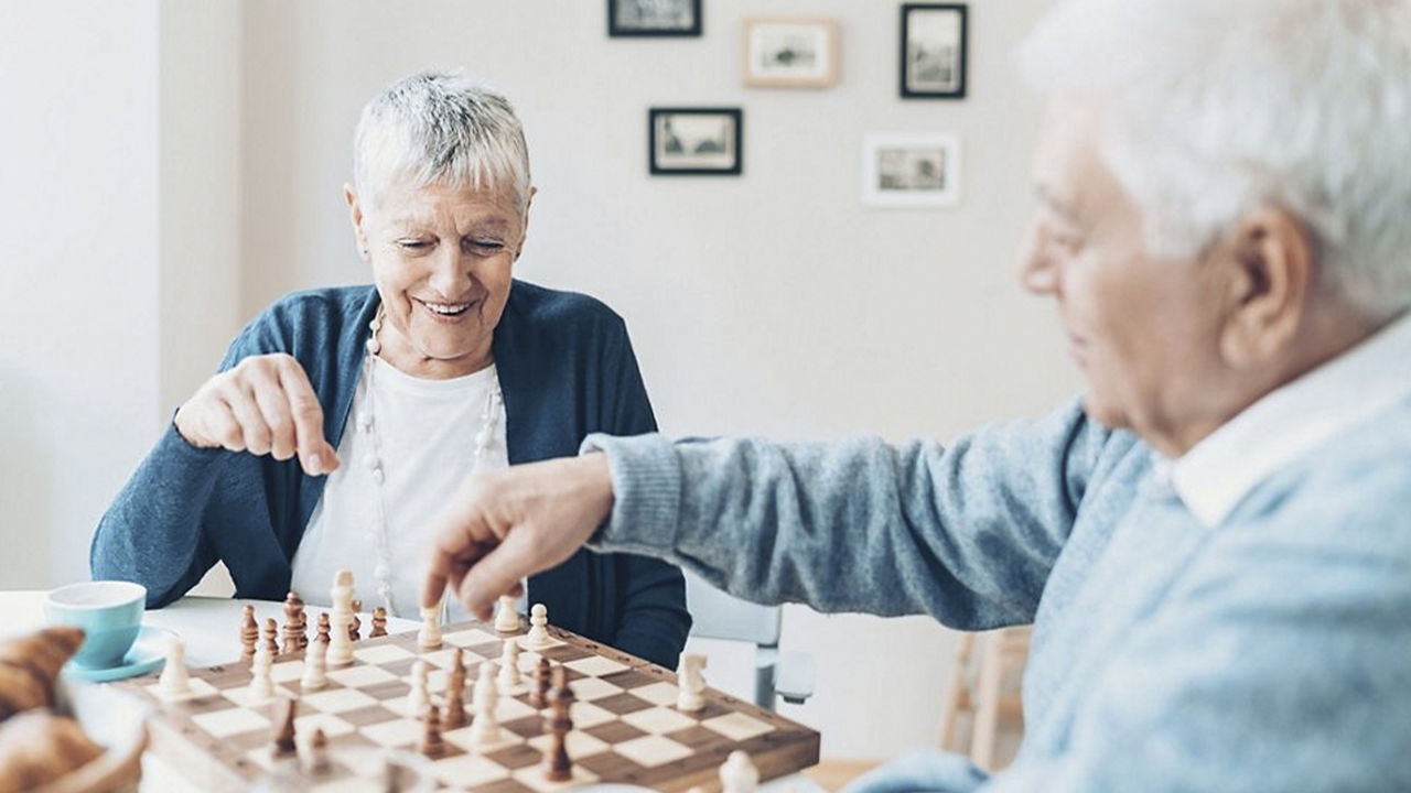 covid-19-elderly-couple-chess.jpg