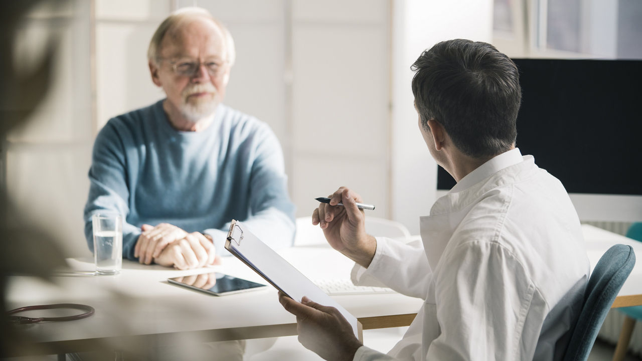 doctor-and-clipboard-with-male-patient-during-consultation.jpg