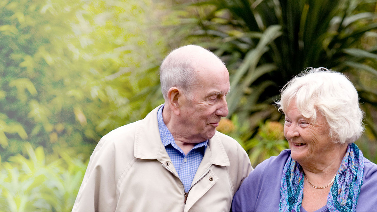 Healthy aging couple smiling - outdoor