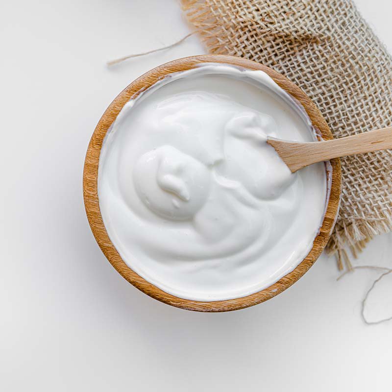 yogurt in plate  with spoon