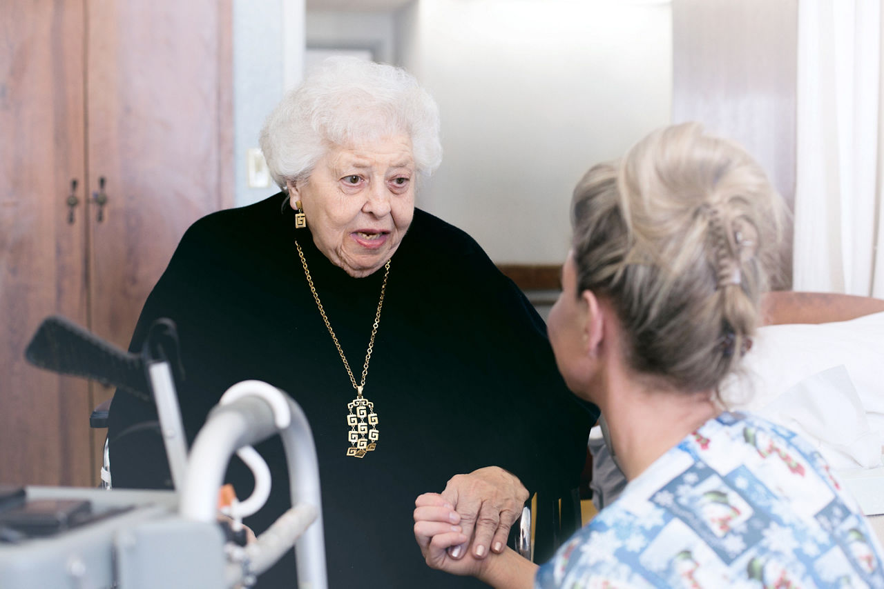 Wound care - Elderly woman talking with nurse