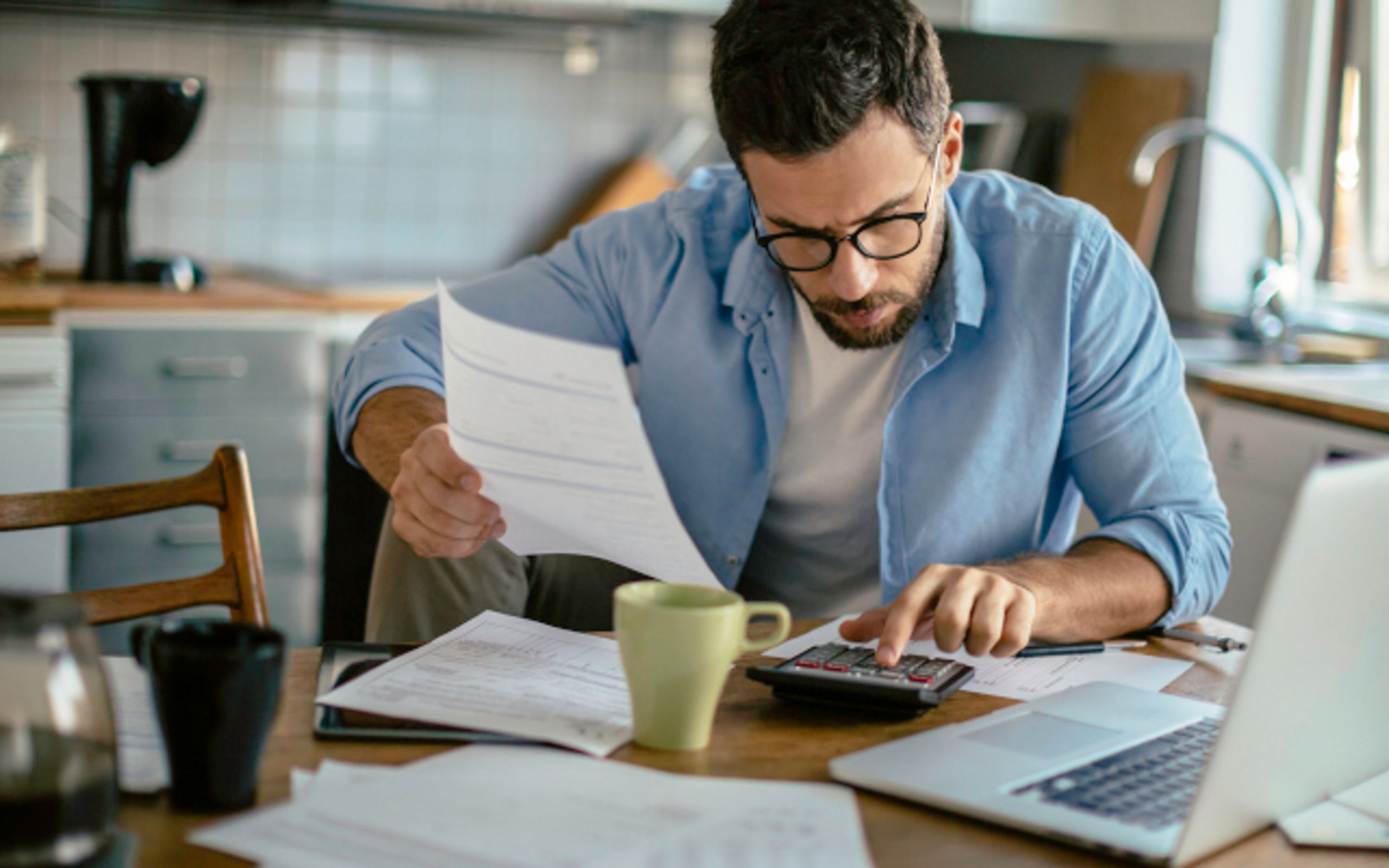 Photo of a man going through his financials problems