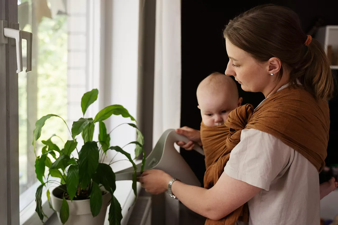 side-view-mother-watering-plants