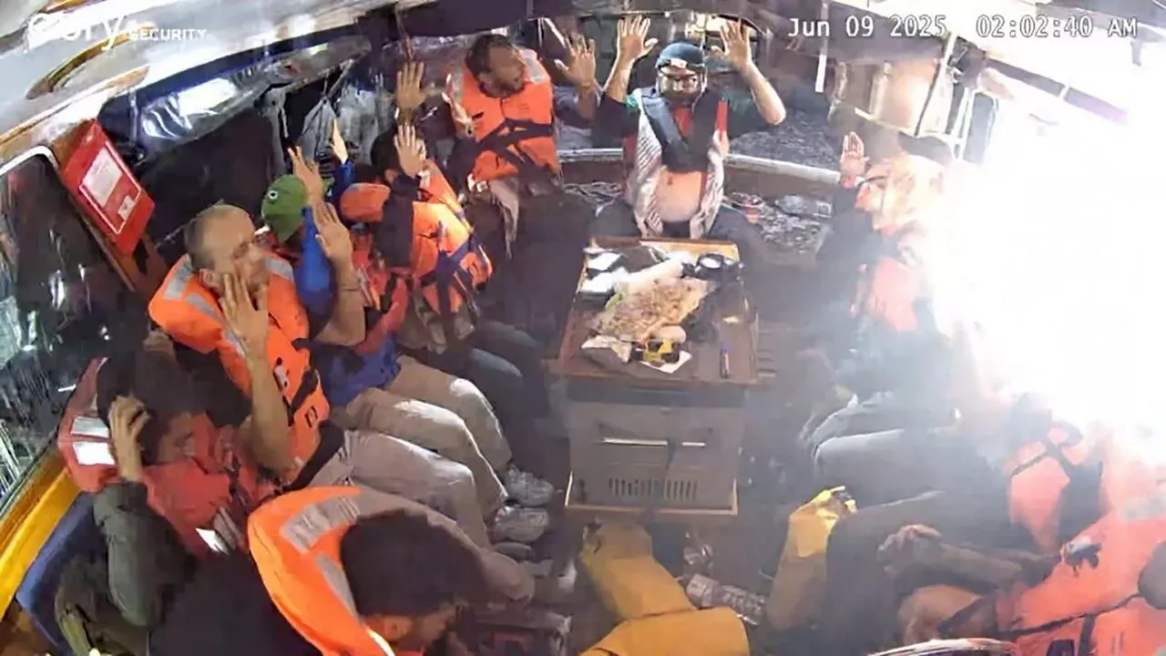 At sea (-), 09/06/2025.- A handout photo made available by The Freedom Flotilla Coalition (FFC) shows the crew of the Gaza-bound Madleen ship seated on the boat, wearing life jackets with their hands up, at sea in the Mediterranean, 09 June 2025. The FFC stated its civilian ship, carrying a small shipment of humanitarian aid, was forcibly intercepted by the Israeli military in international waters on 09 June 2025. Israeli authorities said the flotilla was prevented from breaking a Gaza Strip blockade and was escorted to Israel's port of Ashdod, adding that its passengers were expected to return to their home countries. EFE/EPA/FREEDOM FLOTILLA COALITION HANDOUT -- MANDATORY CREDIT -- BEST QUALITY AVAILABLE -- HANDOUT EDITORIAL USE ONLY/NO SALES
