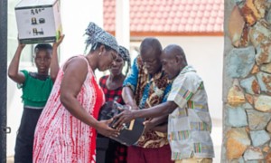 African men and women with improved stove