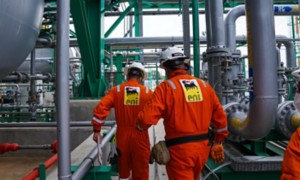 Workers on board the plant