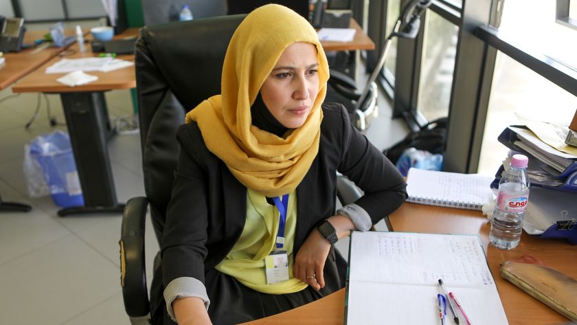 Egyptian woman sitting in office