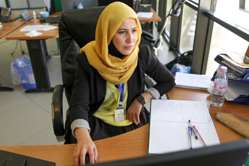 Egyptian woman sitting in office