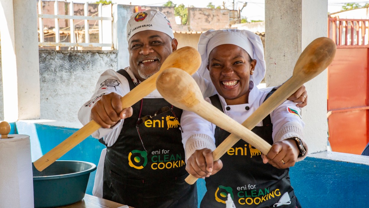 African man and woman posing with wooden cooking spoons