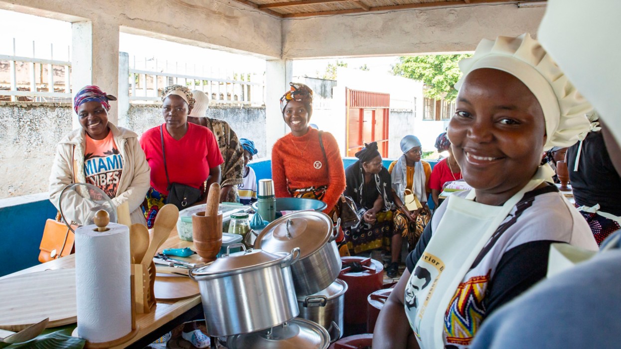 African women posing inside an outdoor kitchen