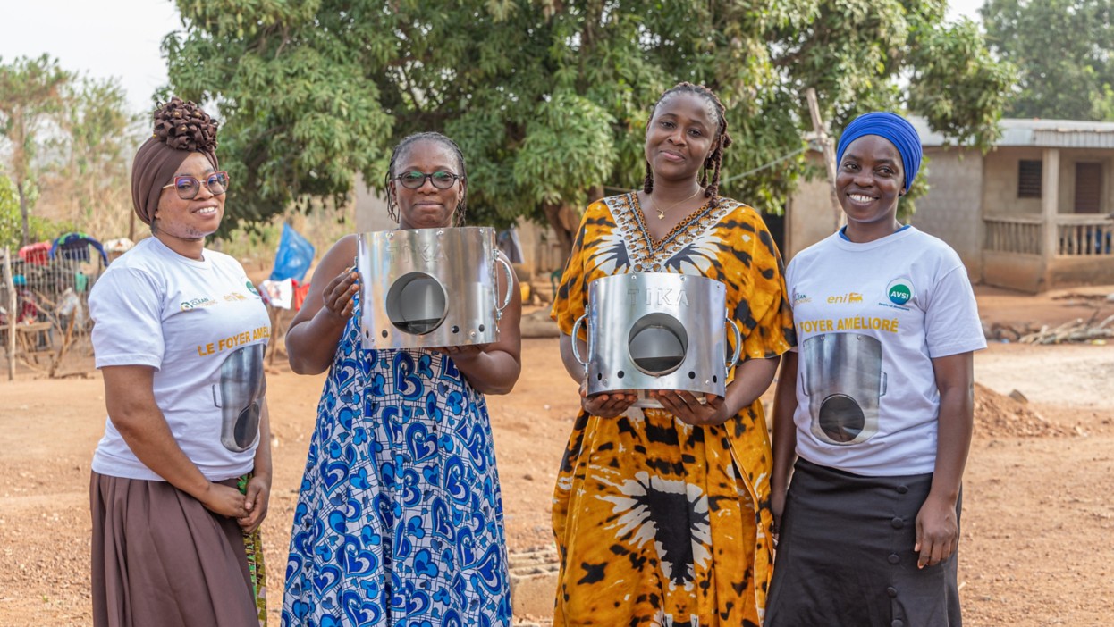 Women show off their improved stoves