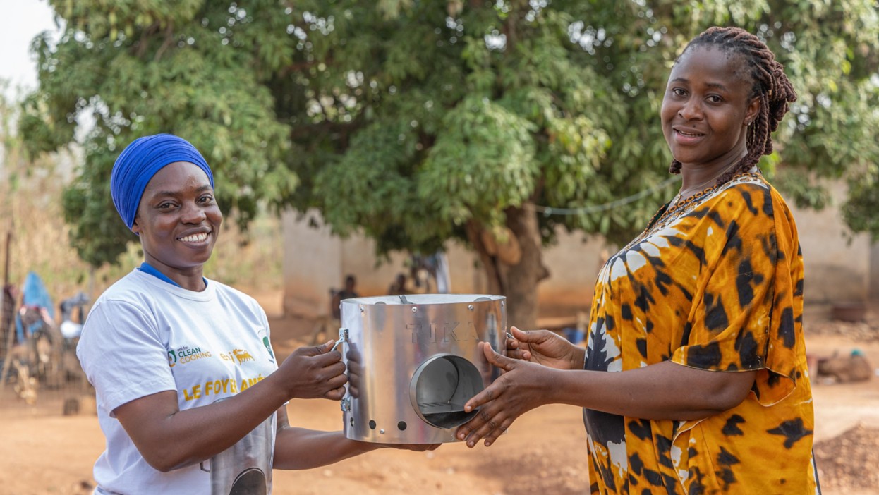 Women demonstrate an improved stove