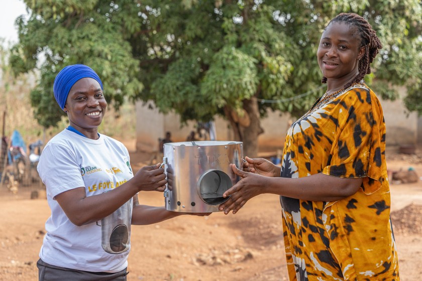 Women demonstrate an improved stove