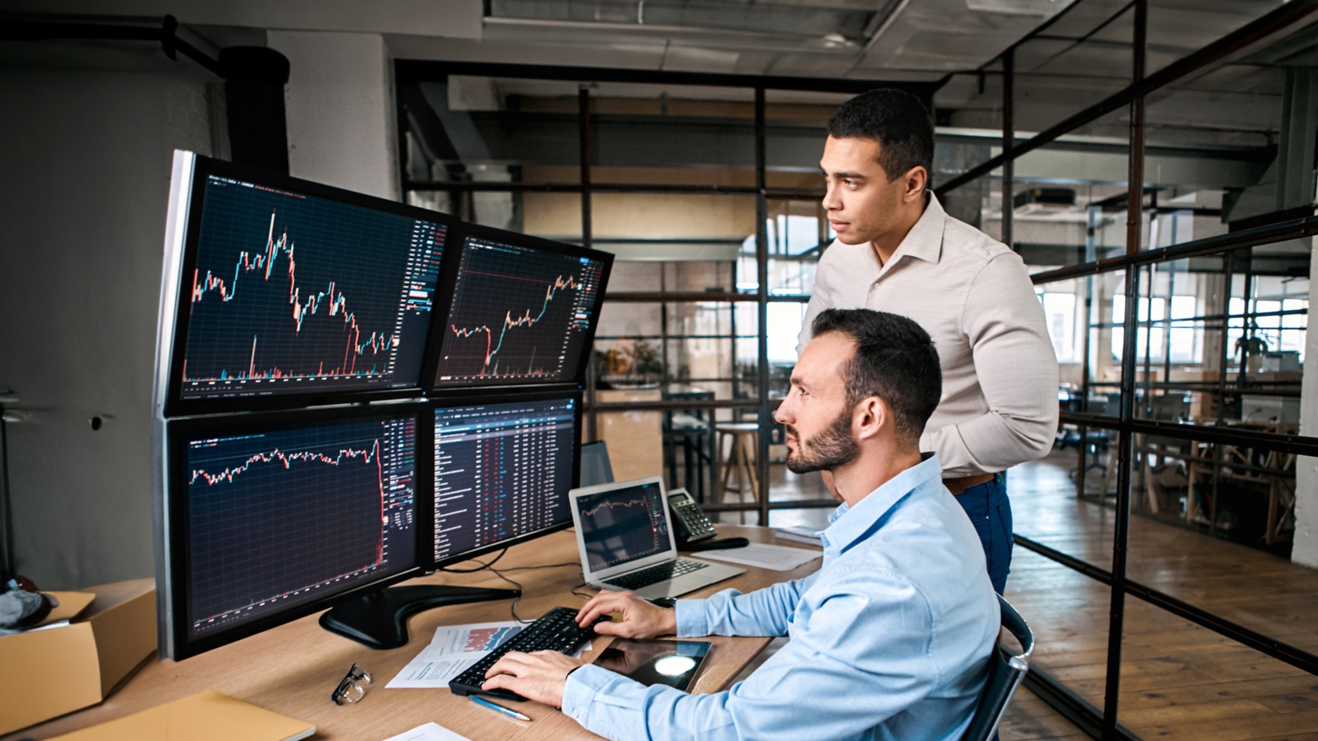 Two managers check stock data