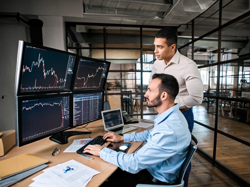 Two managers check stock data
