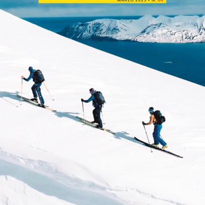 Cover magazine WE 64 che mostra degli sciatori che scendono con gli scii dalla montagna