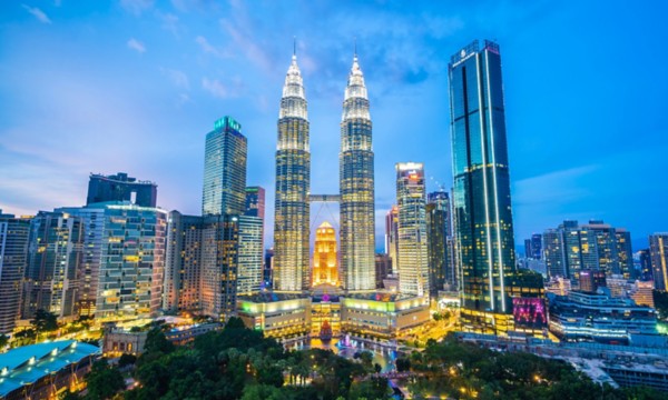 Panoramic night view of the Petronas Towers in Kuala Lumpur, Malaysia