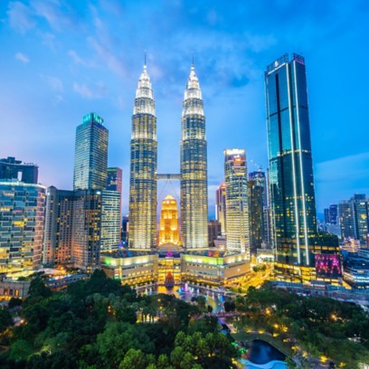 Panoramic night view of the Petronas Towers in Kuala Lumpur, Malaysia