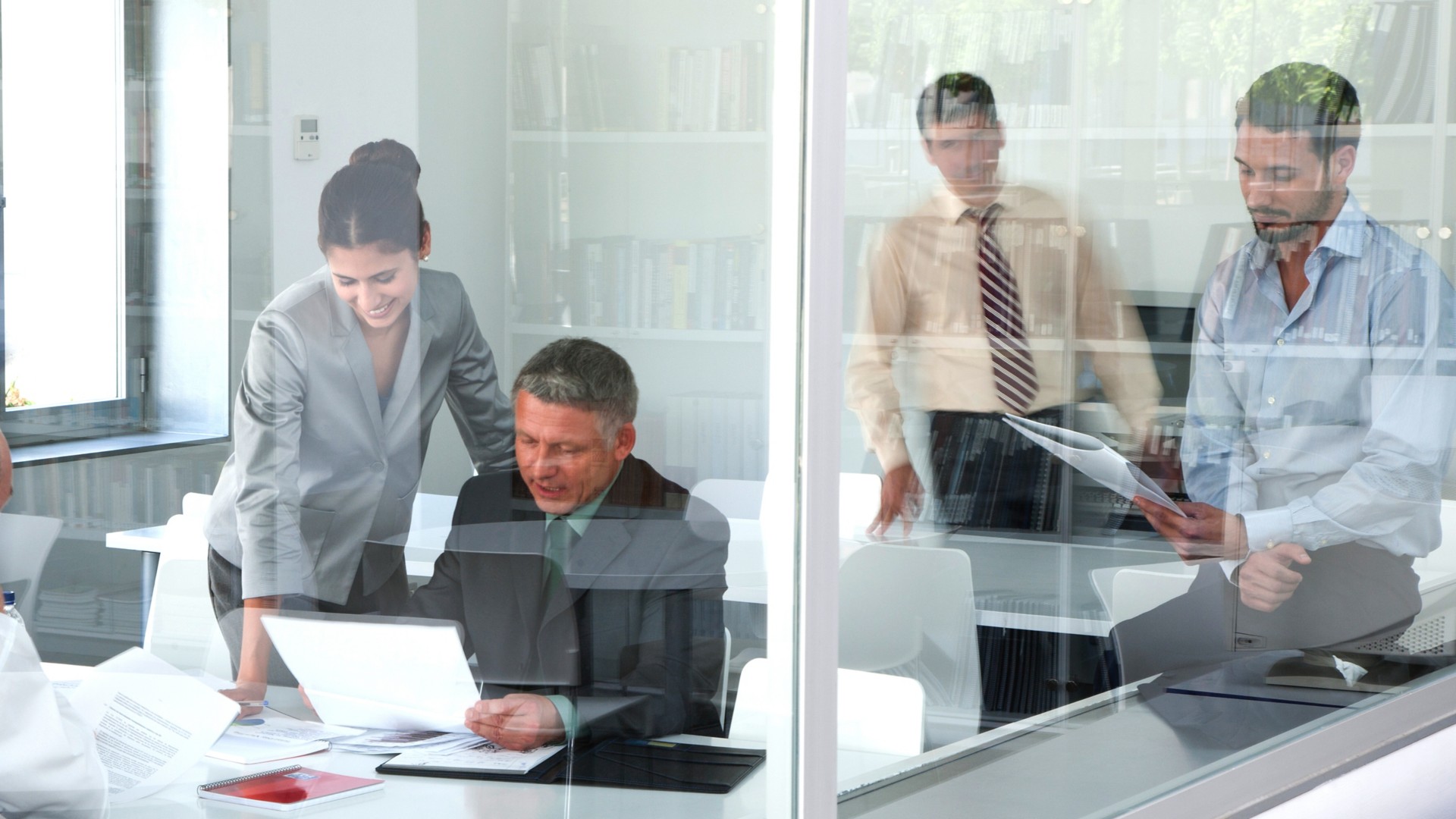 People in the office checking documents