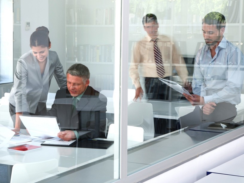 People in the office checking documents