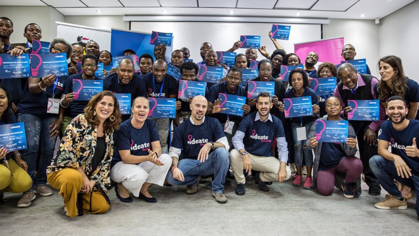 Group photo of the participants at the working table