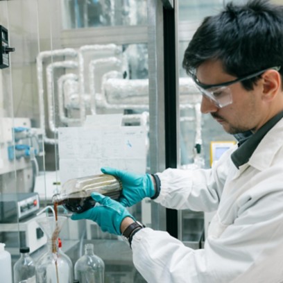 Scientist in lab analyzes liquid sample