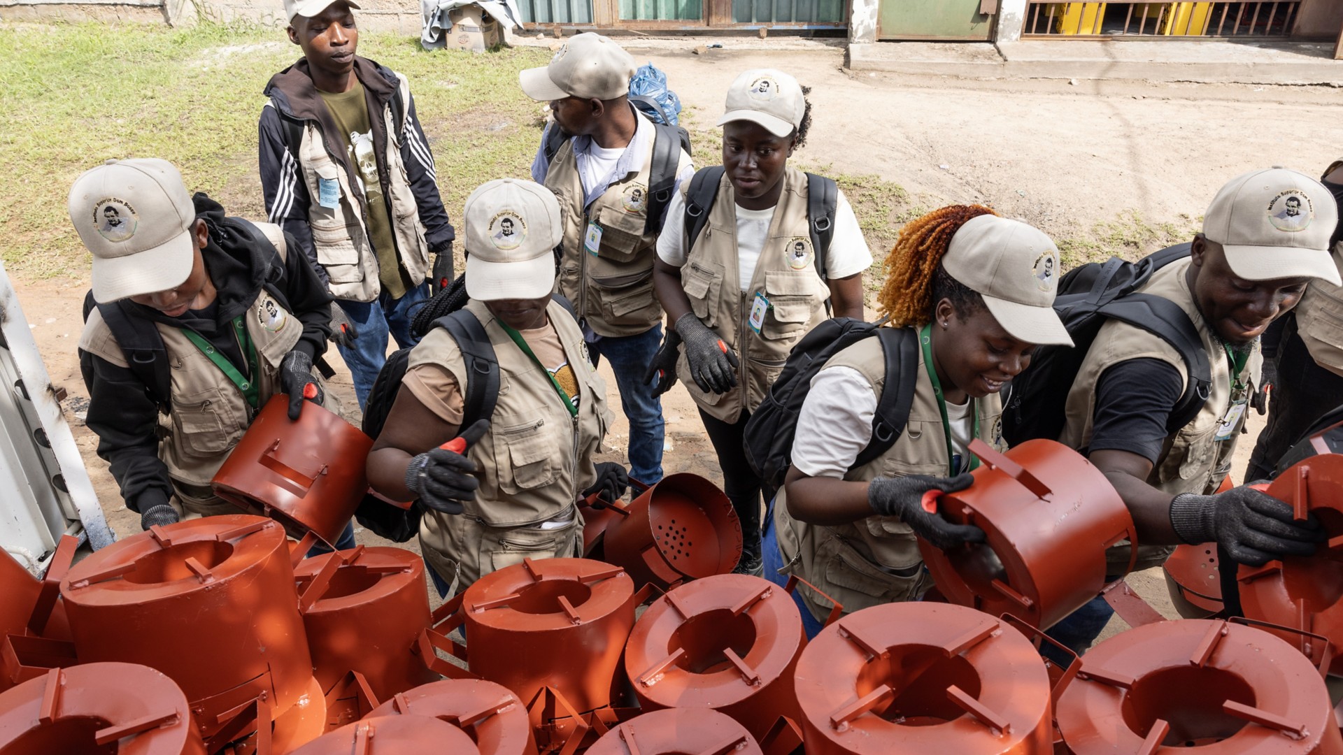 Six people are distributing improved cookstoves.
