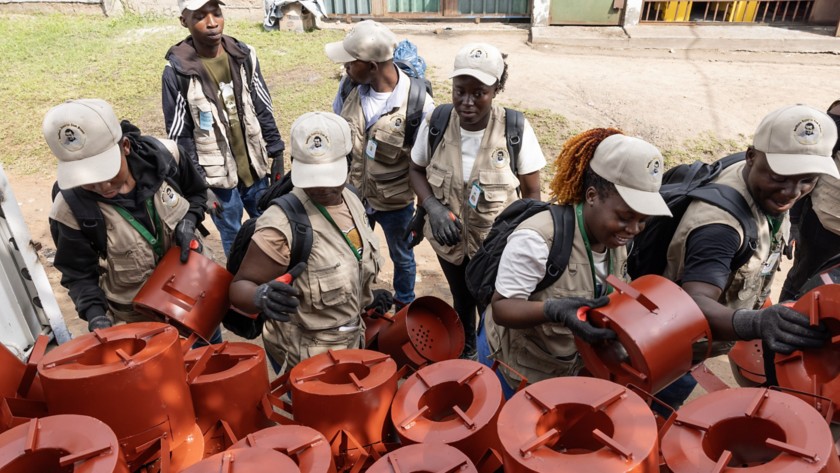 Six people are distributing improved cookstoves.