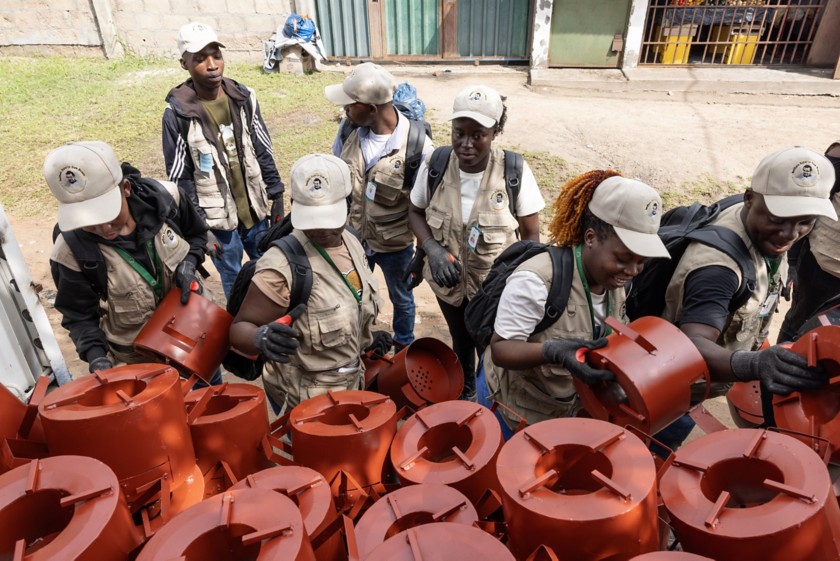 Six people are distributing improved cookstoves.