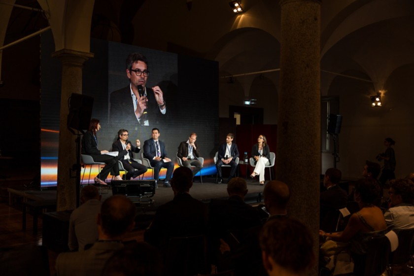 Audience seated in the hall listening during one of the panels