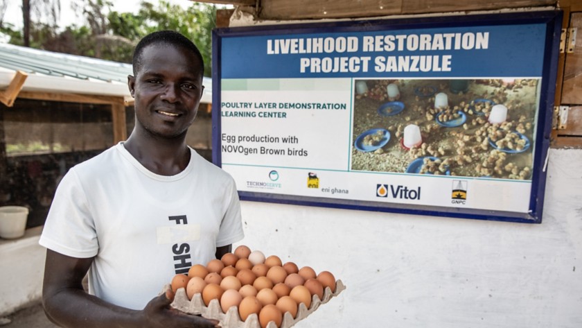 African man holding eggs 