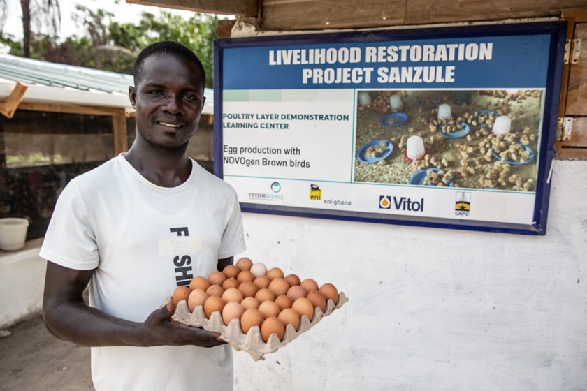 African man holding eggs 