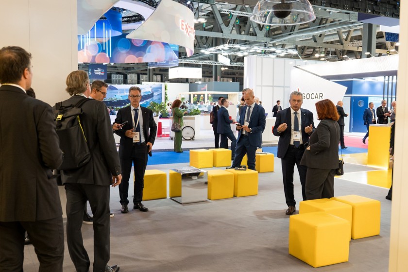 Visitors and sector operators standing at the company stand during the event
