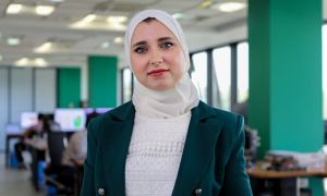 Algerian woman walks into the office