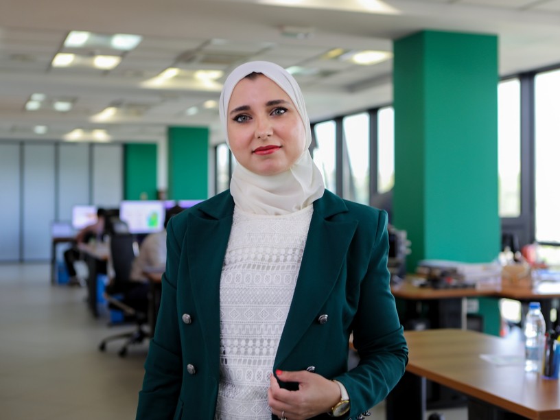 Algerian woman walks into the office